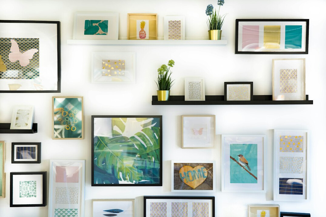 Gallery wall with colorful framed photographs